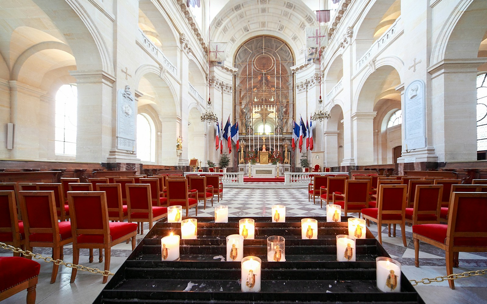 Les Invalides Paris St. Louis Cathedral interior with ornate arches and historic architecture.