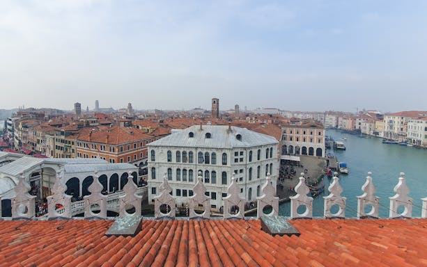 Rooftop view of Venice's Grand Canal near Rialto Bridge, Italy.