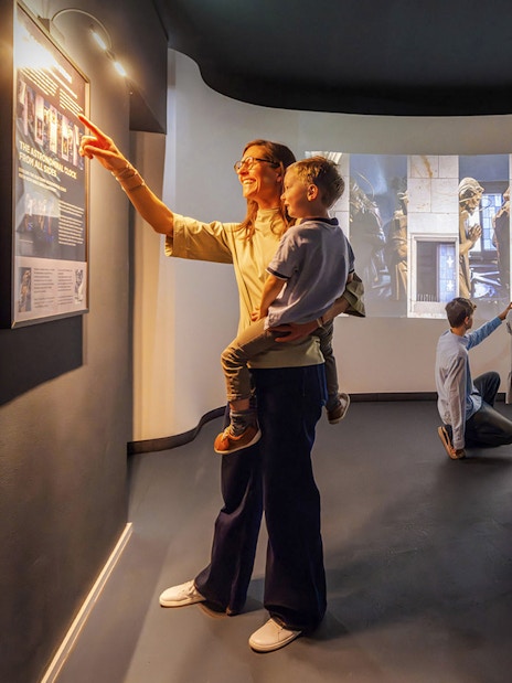 Guests exploring exhibits inside Praga Magica Interactive Exhibition.
