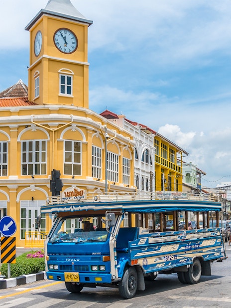 Phuket Old Town with blue local bus and Sino-Portuguese architecture on a guided tour.