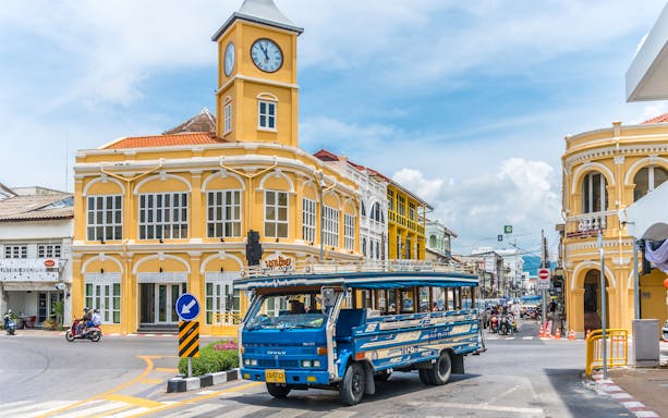 Phuket Old Town with blue local bus and Sino-Portuguese architecture on a guided tour.