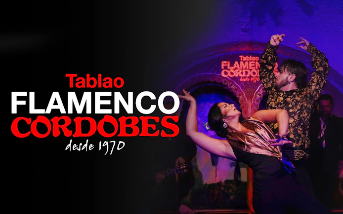 Flamenco dancers performing at Tablao Cordobes in vibrant traditional attire.
