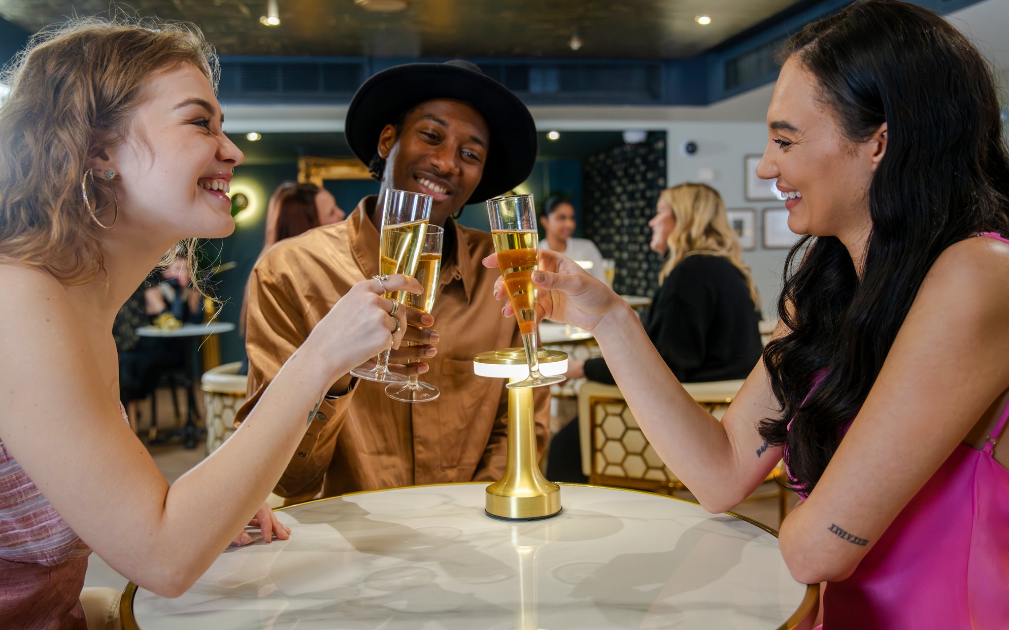 Guests enjoying drinks at The Champagne Bar in Madame Tussauds London.