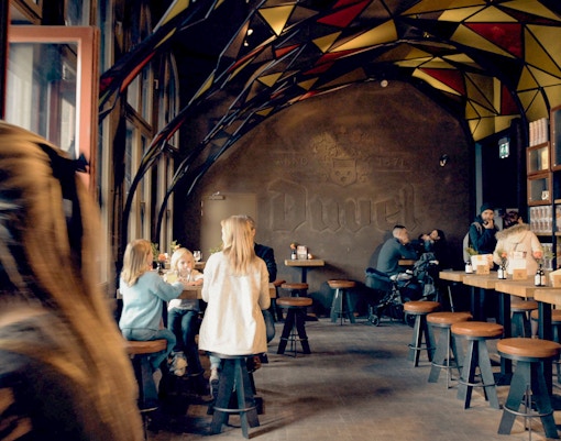 An interior vintage setting of the cafe at Historium Bruges.