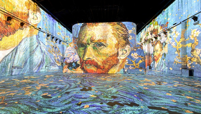 Van Gogh's self-portrait projected in Fabrique des Lumières exhibition hall.