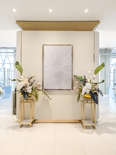 Miracle Lounge entrance with floral arrangements, Bangkok Airport, Thailand.