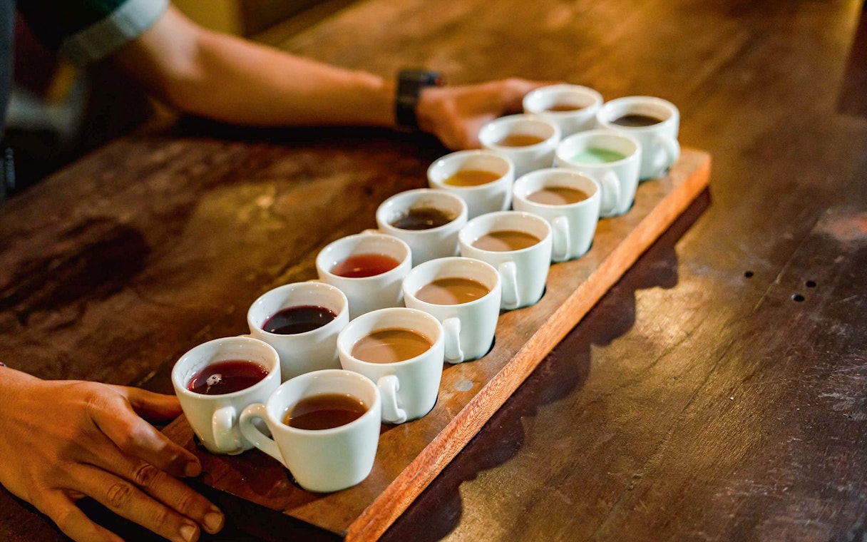 Coffee tasting samples on a wooden tray at Alas Harum, Bali.