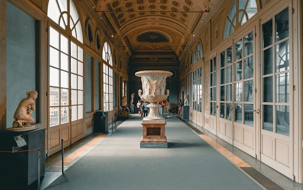 Uffizi Gallery interior with sculptures and large urn, Florence Wonders Walking Tour.