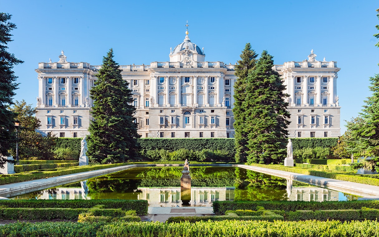 Gardens with statues and pond near the Royal Palace of Madrid.