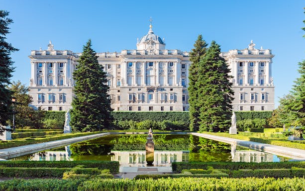 Gardens with statues and pond near the Royal Palace of Madrid.