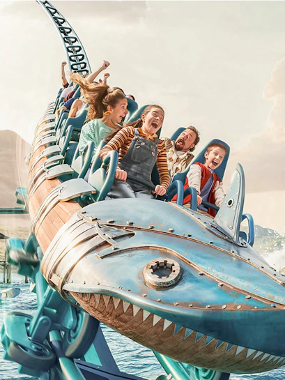 Roller coaster ride with excited passengers at Walibi Belgium.