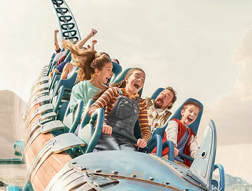 Roller coaster ride with excited passengers at Walibi Belgium.