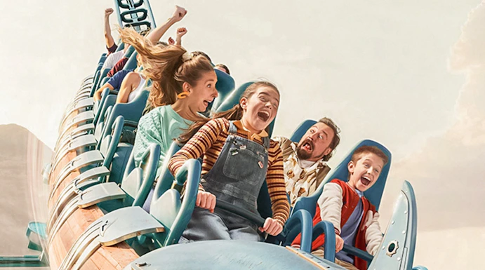 Roller coaster ride with excited passengers at Walibi Belgium.