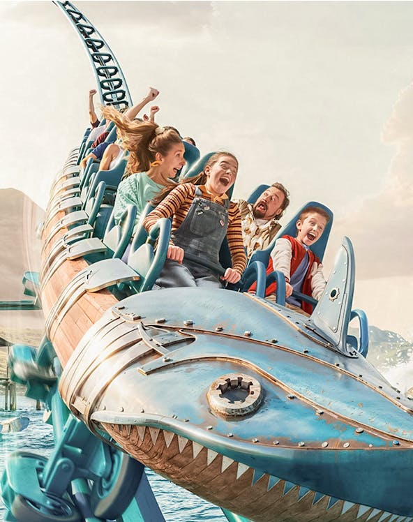 Roller coaster ride with excited passengers at Walibi Belgium.