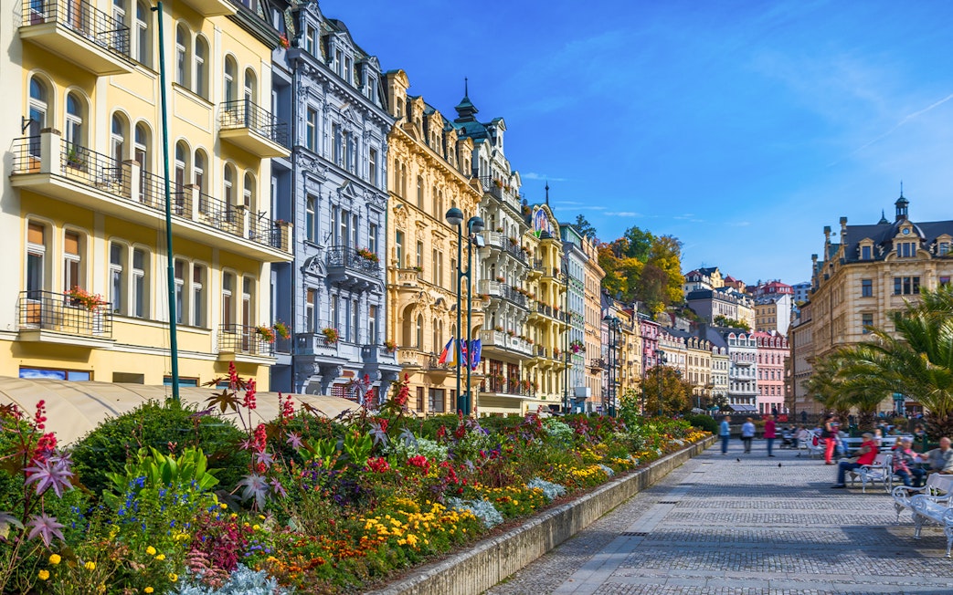 Colorful historic buildings and gardens in Karlovy Vary, Czech Republic, on a day trip from Prague.