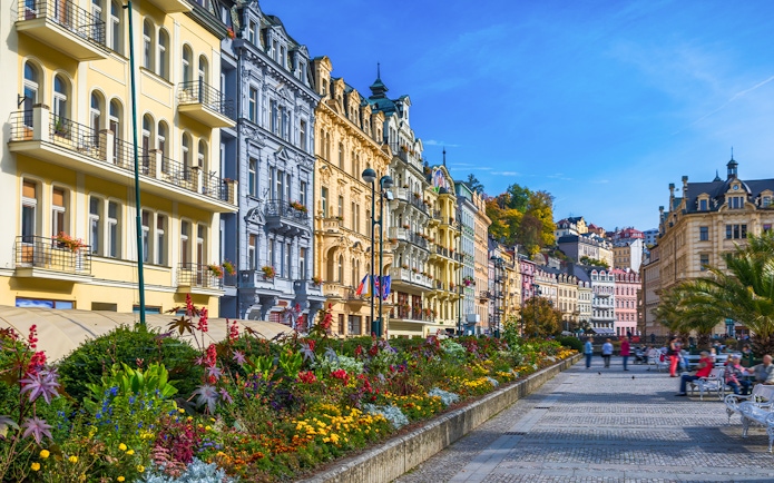 Colorful historic buildings and gardens in Karlovy Vary, Czech Republic, on a day trip from Prague.