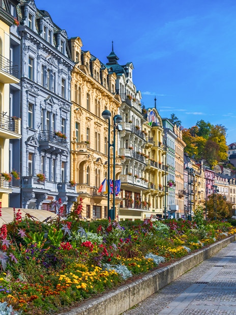 Colorful historic buildings and gardens in Karlovy Vary, Czech Republic, on a day trip from Prague.
