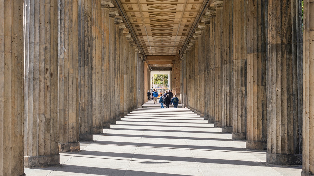 Altes Museum columns with sunlight streaming through, Museum Island, Berlin, Germany.