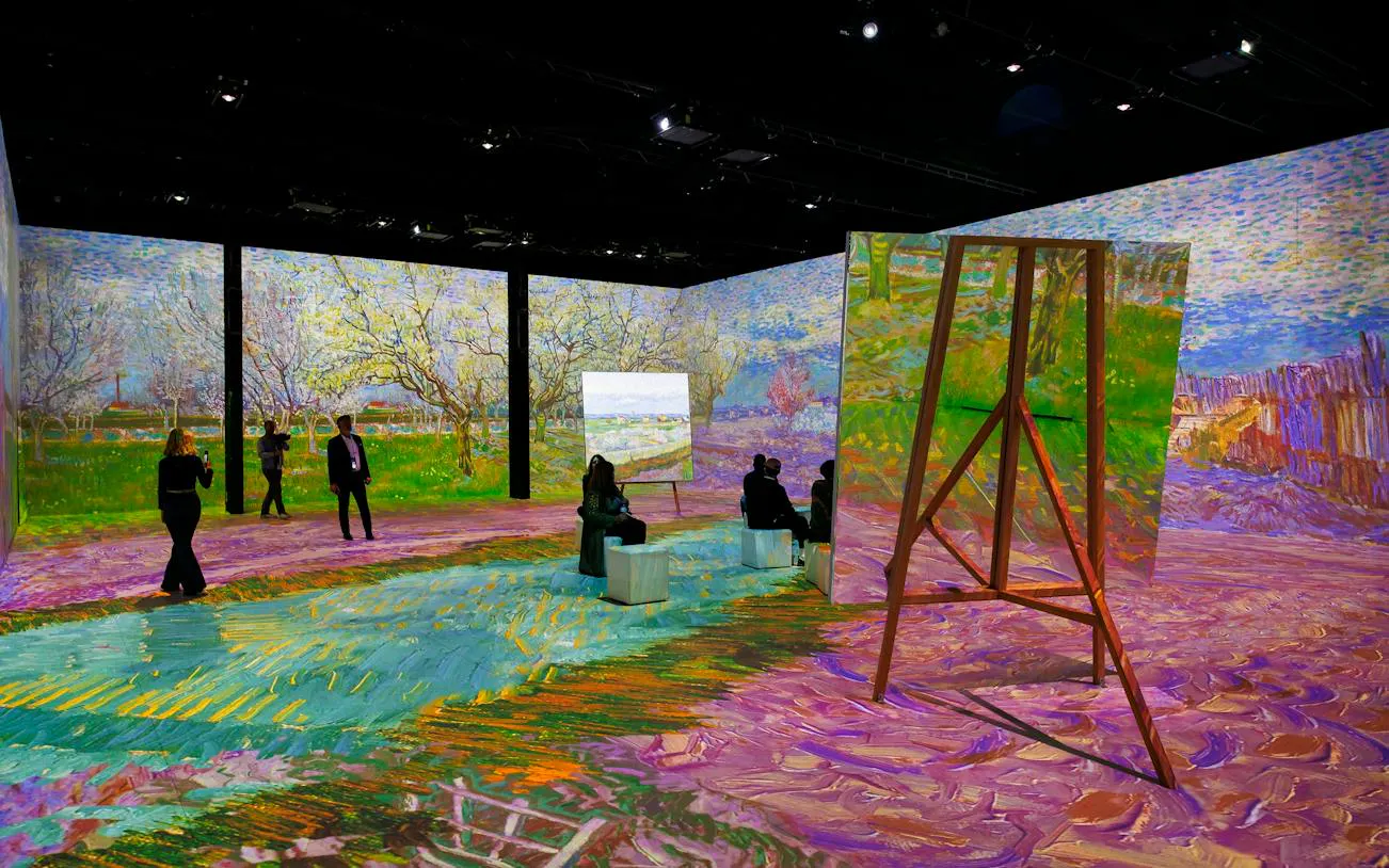 Van Gogh immersive exhibition in Zurich with projected artwork and visitors exploring.