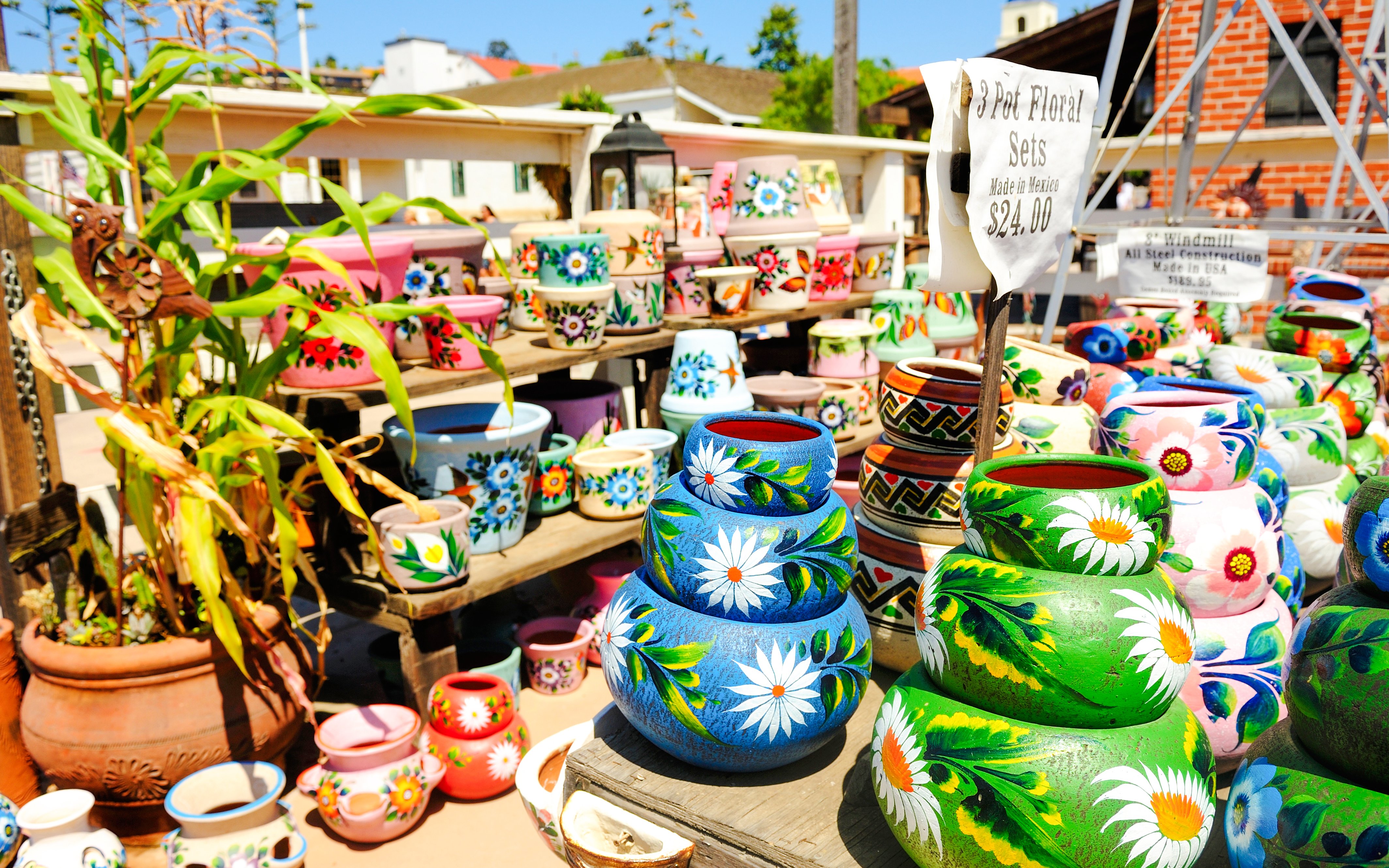 Colorful hand-painted pottery on display in Old Town San Diego marketplace.