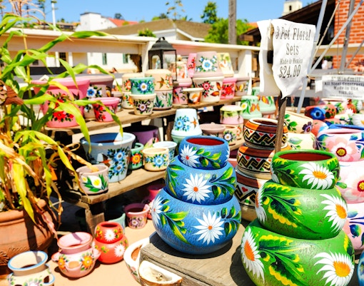 Colorful hand-painted pottery on display in Old Town San Diego marketplace.