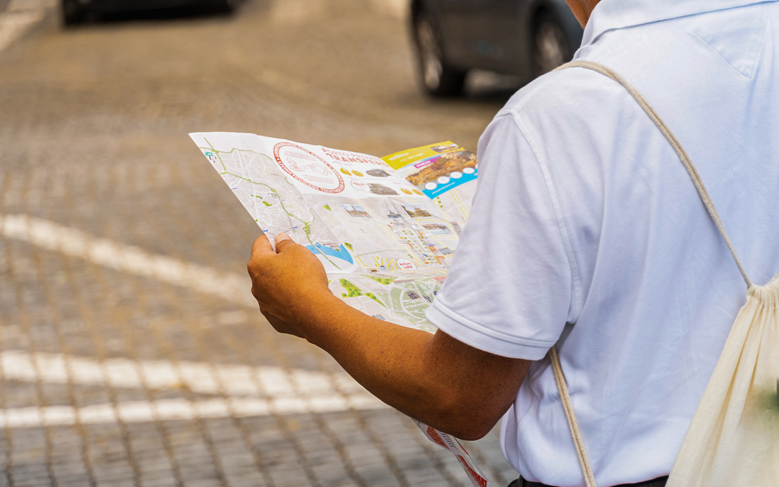 Tourist examining a zoo map.