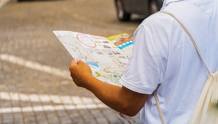 Tourist looking at maps