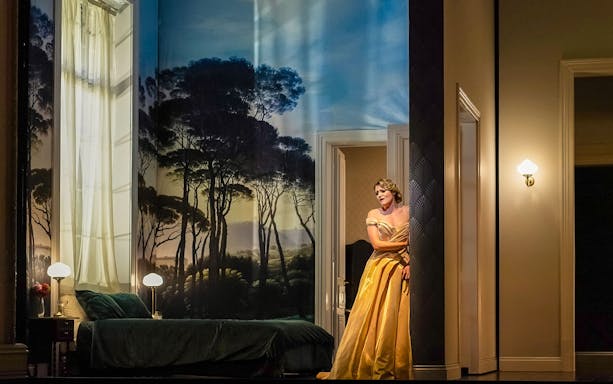 Performer in yellow gown on stage at Sydney Opera House for NYE La Traviata.