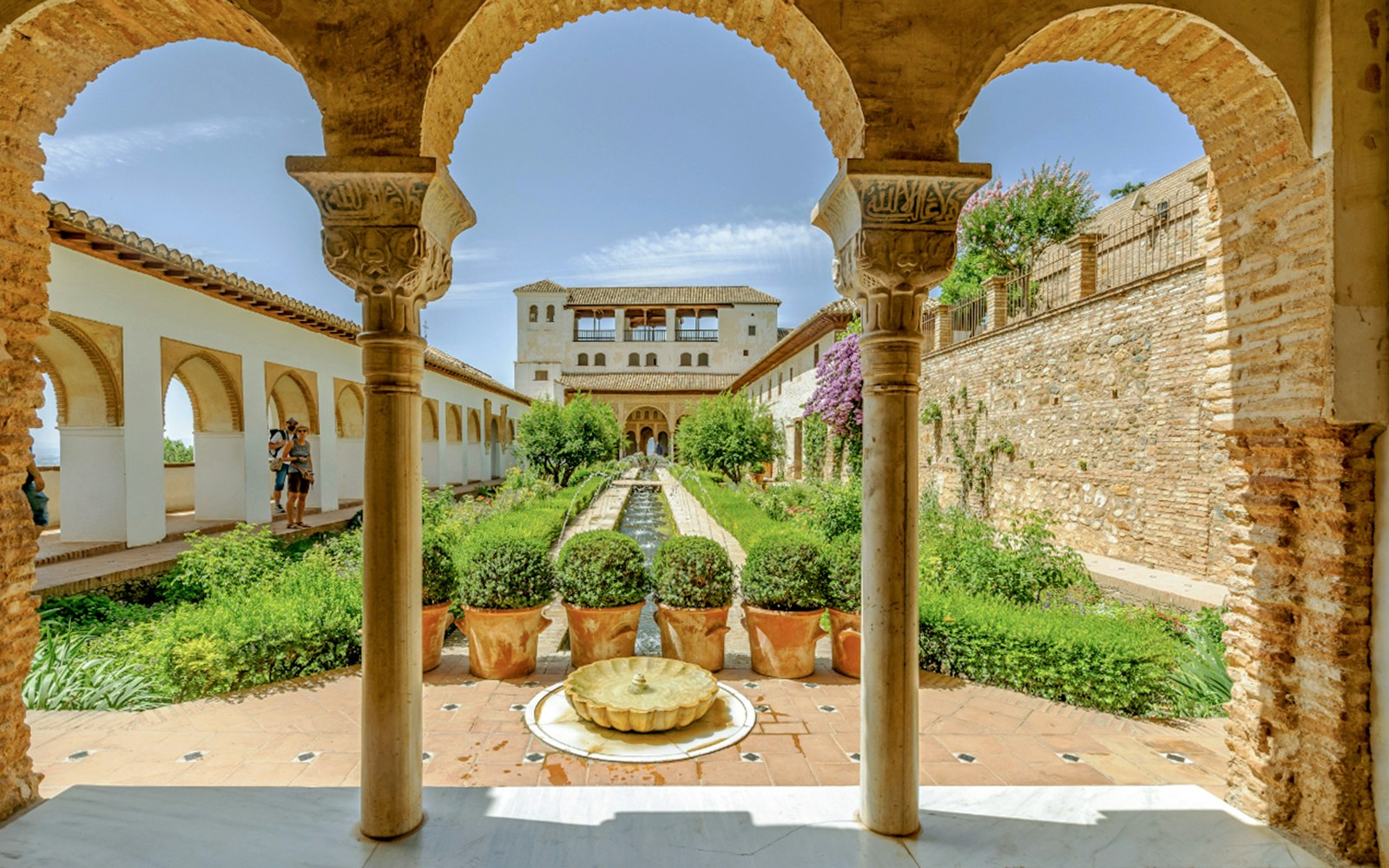 Generalife Gardens with arches and fountain at Alhambra, Spain.