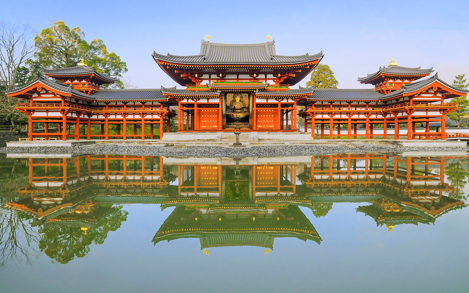 Byodo-in Temple in Uji, Japan, reflecting in a serene pond.