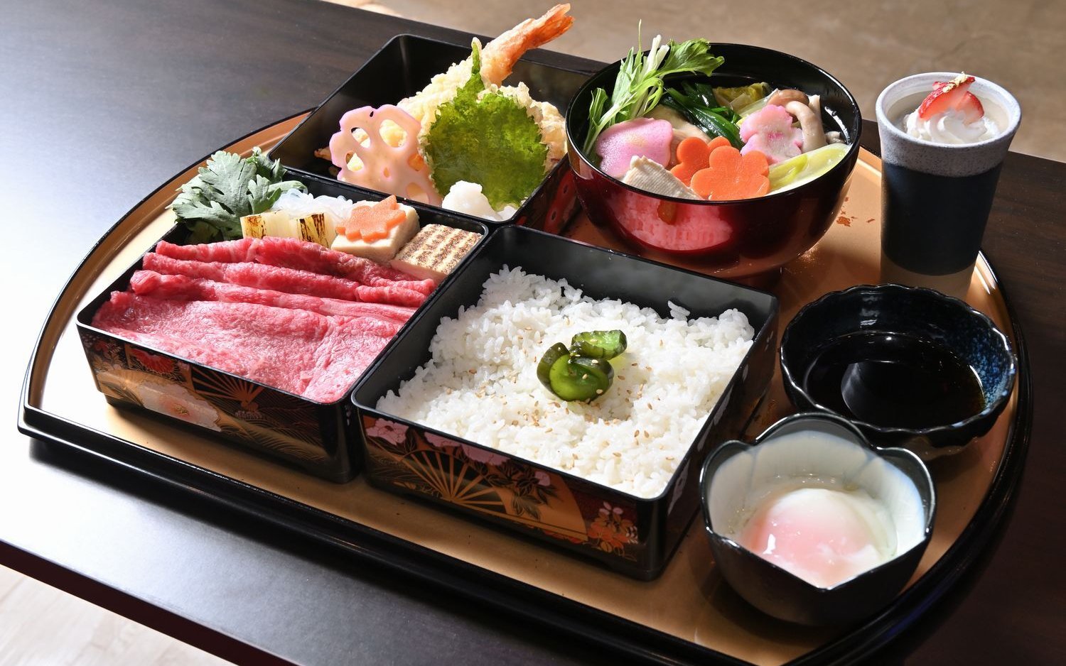 Wagyu beef bento with rice, vegetables, and dessert for Luxury Sumo Show Experience.