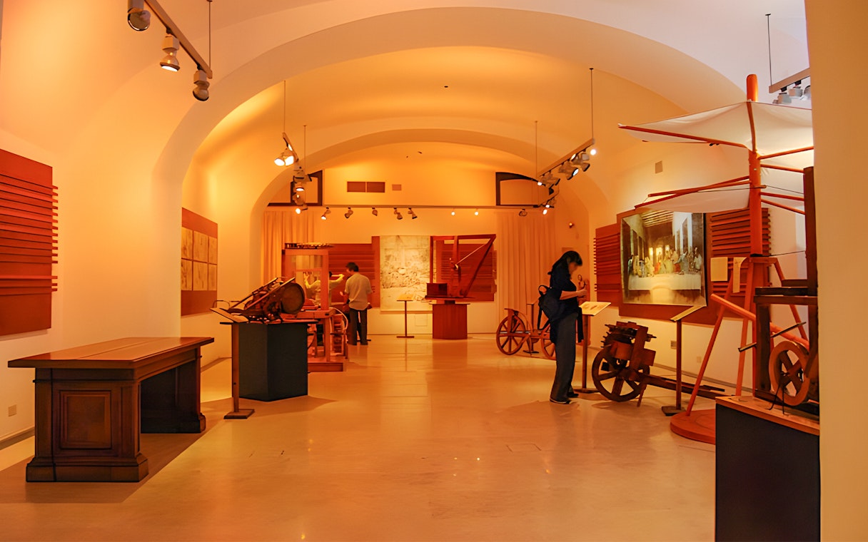 Exhibit of Leonardo da Vinci's inventions at the museum, featuring models and sketches.