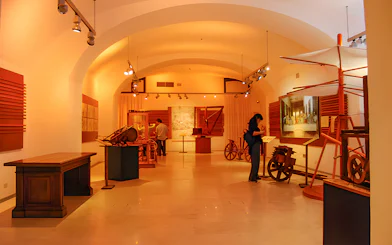 Exhibit of Leonardo da Vinci's inventions at the museum, featuring models and sketches.