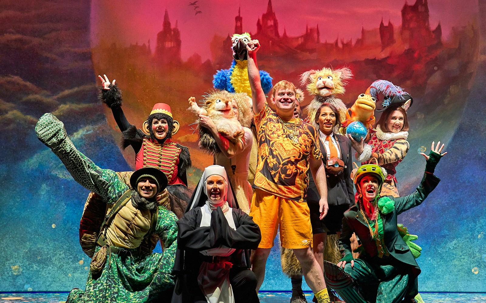 Mother Goose play at London theater with actors in colorful costumes on stage.