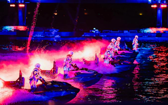Jet skiers in neon suits perform at night during Symphony of the Sea, Phu Quoc.
