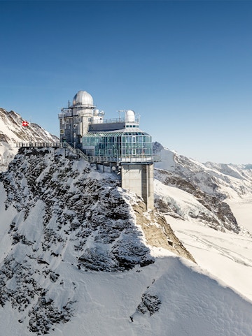 Jungfraujoch observatory on snowy mountain peak in Switzerland.
