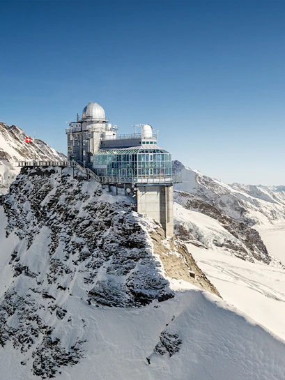 Jungfraujoch observatory on snowy mountain peak in Switzerland.