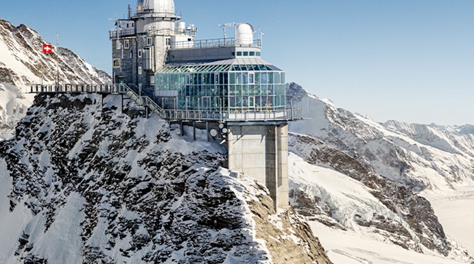 Jungfraujoch observatory on snowy mountain peak in Switzerland.