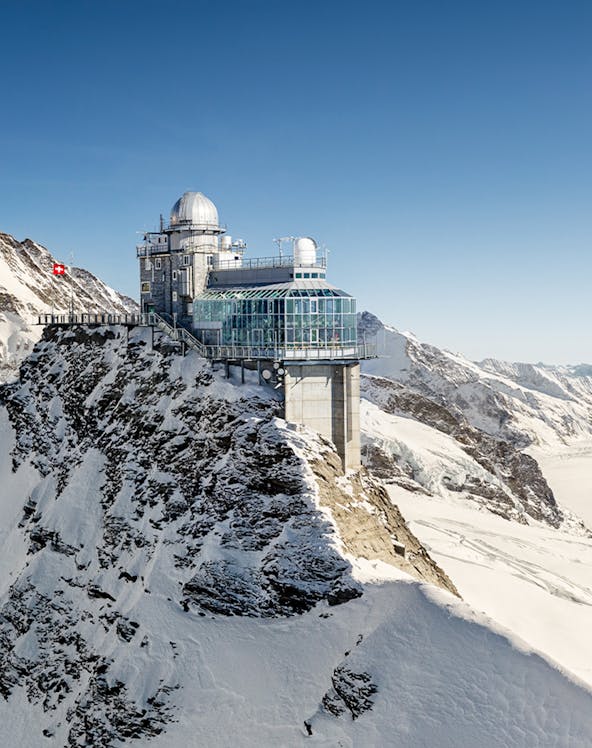 Jungfraujoch observatory on snowy mountain peak in Switzerland.