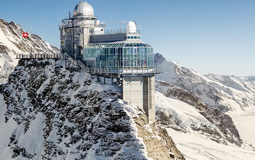 Jungfraujoch observatory on snowy mountain peak in Switzerland.