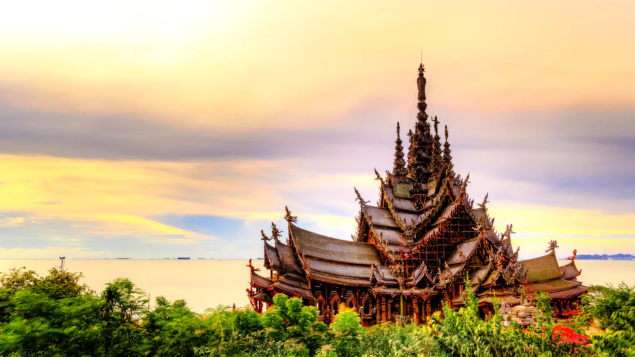 Sanctuary of Truth temple by the sea during sunset, Pattaya city tour.