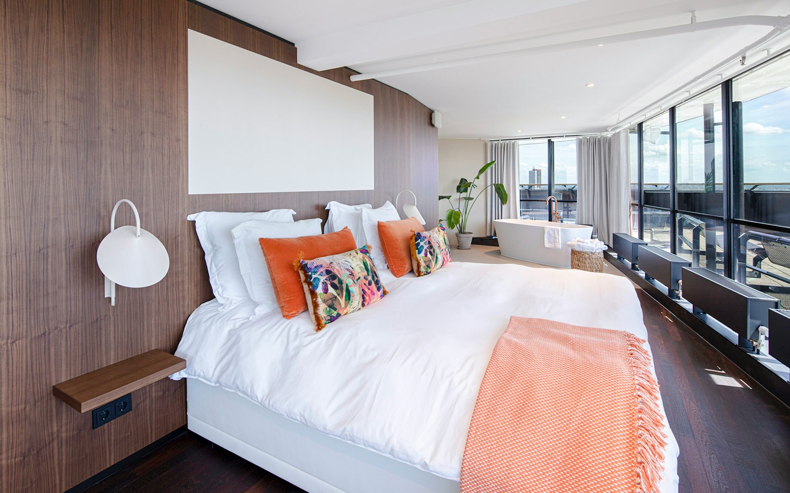 Luxurious suite with large bed and bathtub at Euromast, Rotterdam.