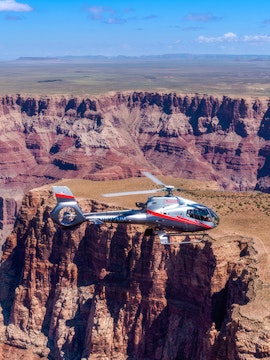 Maverick helicopter flying over the Grand Canyon.