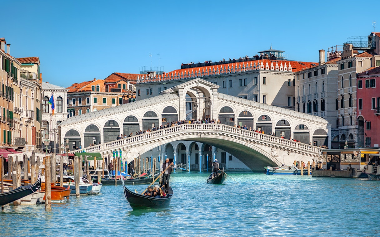 Gondolas on the Grand Canal near Rialto Bridge, Venice.