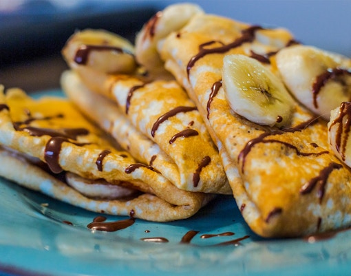 Crepes with banana and chocolate drizzle at a Mont Saint Michel restaurant.