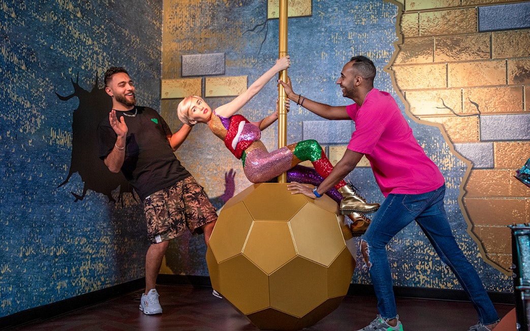 Miley Cyrus wax figure on a wrecking ball at Madame Tussauds Dubai.