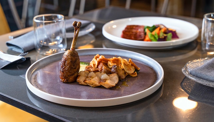 Glazed duck confit served on a plate fro breakfast