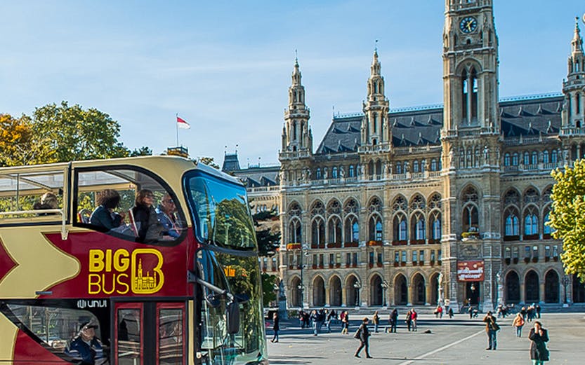 Open-top Big Bus tour in front of Vienna City Hall, Austria.