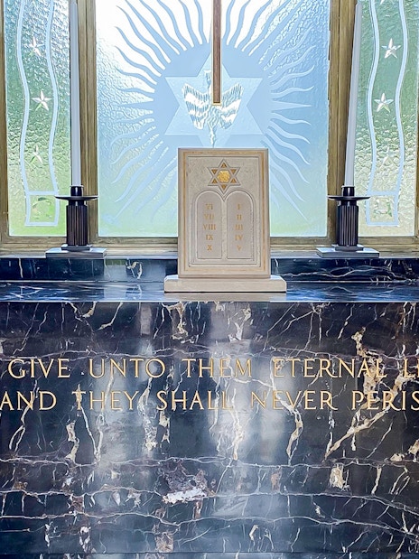Memorial altar with flags at Normandy American Cemetery, D-Day Normandy Beaches Day Trip.