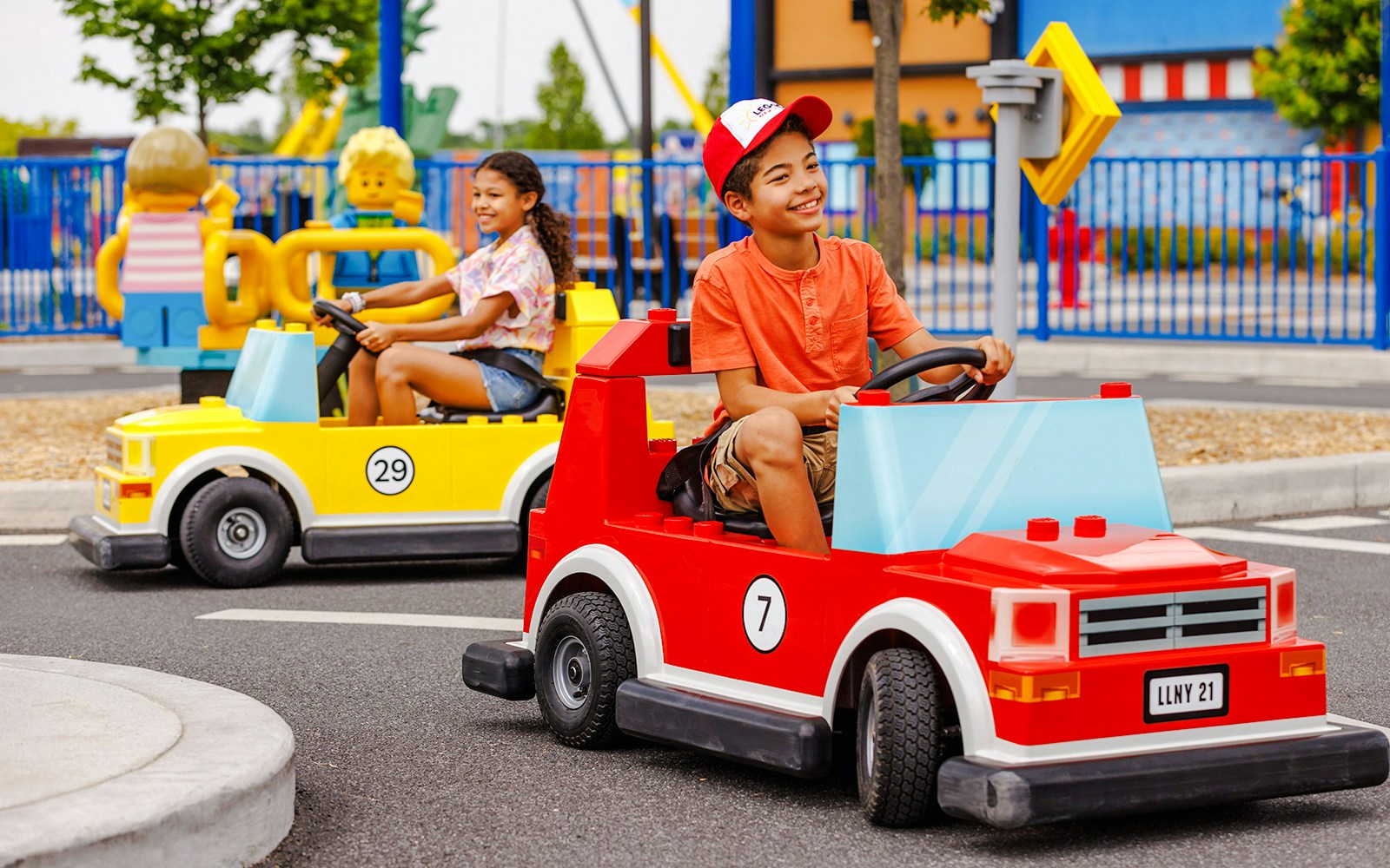 Children driving Lego cars at Legoland New York.